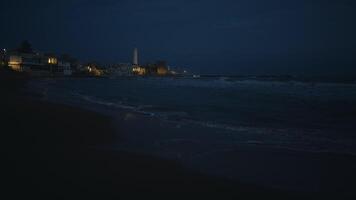 Beam of light cast by the lighthouse at night video