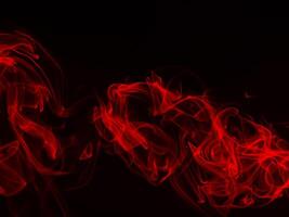 Red smoke on black background, fire design photo