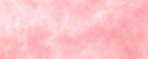 An illustration of a watercolor background in a soft pink hue, providing a textured appearance suitable for design purposes. photo