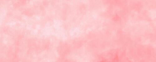 An illustration of a watercolor background in a soft pink hue, providing a textured appearance suitable for design purposes. photo