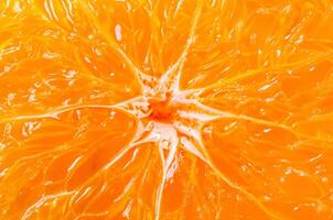 el naranja antecedentes es hecho desde un rebanada de un naranja. foto