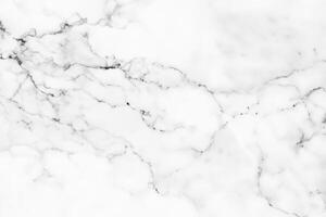 High-resolution white marble texture and background offer a luxurious decorative design pattern for artwork. The marble's exquisite quality adds to its appeal. photo