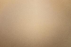 A background of matte gold or gold metal texture. photo