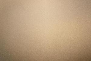 A background of matte gold or gold metal texture. photo