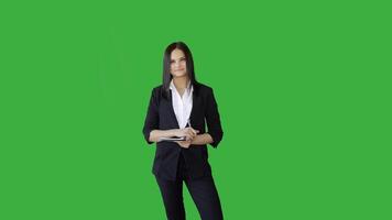 Attractive Young Businesswoman Standing Against Green Screen Background video