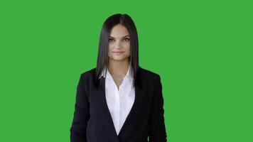 Attractive Young Businesswoman Standing Against Green Screen Background video