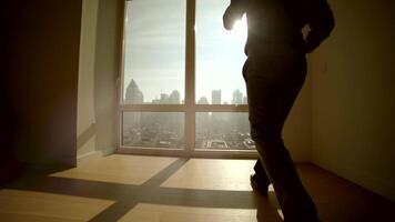 Young Successful Man Living in High Rise City Apartment With Skyline View video