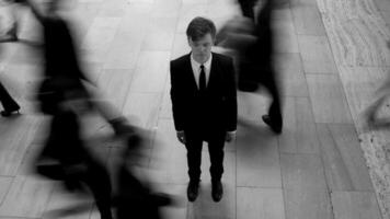 Young Businessman Surrounded By Pedestrians Commuting in the City Streets video