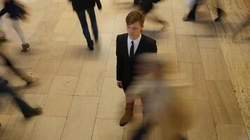 Young Businessman Surrounded By Pedestrians Commuting in the City Streets video