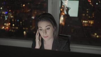 Young Confident Woman Working in Modern Office on Computer Desk At Night video