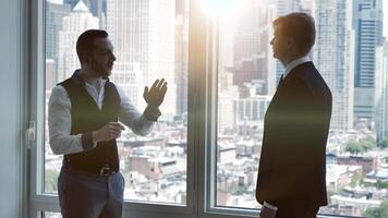 Two Young Business Coworkers Talking Together Working in Finance Career Job video