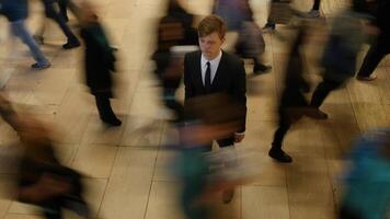 Man Standing Out Of The Crowd People Walking on Crowded Street video