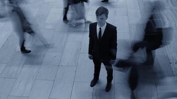 Man Standing Out Of The Crowd People Walking on Crowded Street video