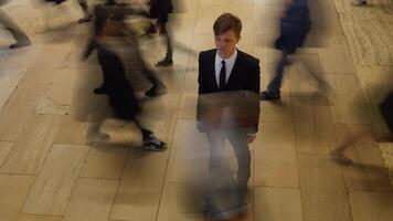 Man Standing Out Of The Crowd People Walking on Crowded Street video