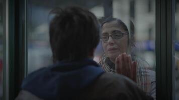 Mother Saying Goodbye to Son Waving Hands and Leaving Unhappy video