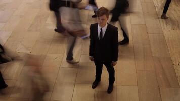 Man Standing Out Of The Crowd People Walking on Crowded Street video