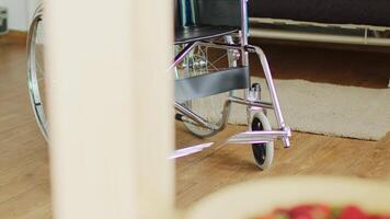 Brand new wheelchair in empty room. Medical equipment. video