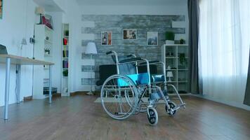 Zoom in shot of medical wheelchair in empty room. video