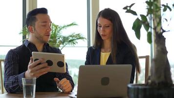 Businesswoman Talking to Businessman Using Laptop Computer Screen video