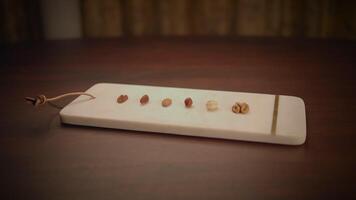 Mixed Nuts of Almonds Pecan Walnuts Cashews Hazelnuts on Wooden Table video