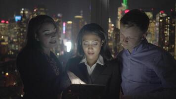 Group of Young Diverse Friends Watching Video On Tablet Screen