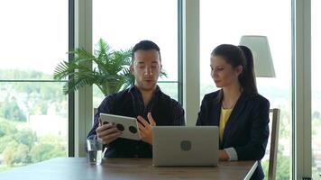 Businesswoman Talking to Businessman Using Laptop Computer Screen video