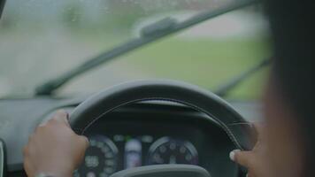 Young African Woman Driving Car On Urban City Street Commuting video