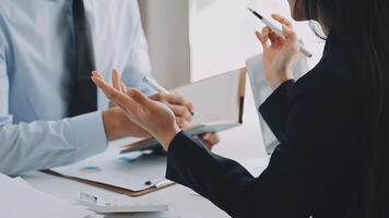 Business team meeting present, investor colleagues consultation and conference new strategy plan business and market growth on financial document graph report, Meeting and Talking. video