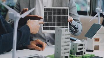 Diverse group of business people planning for alternative energy utilization for greener sustainable Earth by reducing CO2 emission and carbon credit with renewable clean energy technology. Quaint video
