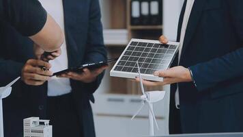 Diverse group of business people planning for alternative energy utilization for greener sustainable Earth by reducing CO2 emission and carbon credit with renewable clean energy technology. Quaint video