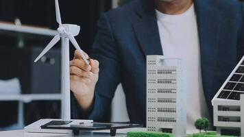 Diverse group of business people planning for alternative energy utilization for greener sustainable Earth by reducing CO2 emission and carbon credit with renewable clean energy technology. Quaint video