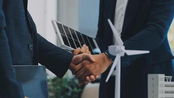 Diverse group of business people planning for alternative energy utilization for greener sustainable Earth by reducing CO2 emission and carbon credit with renewable clean energy technology. Quaint video