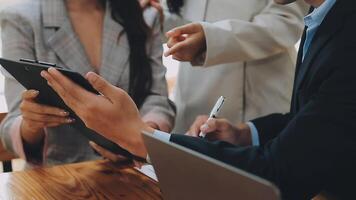 Business team meeting present, investor colleagues consultation and conference new strategy plan business and market growth on financial document graph report, Meeting and Talking. video