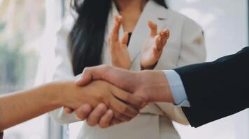 Business handshake for teamwork of business merger and acquisition,successful negotiate,hand shake,two businessman shake hand with partner to celebration partnership and business deal concept video