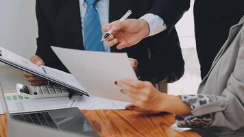 Business team meeting present, investor colleagues consultation and conference new strategy plan business and market growth on financial document graph report, Meeting and Talking. video