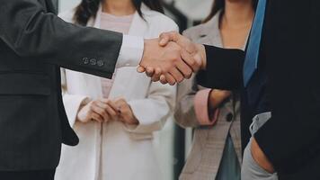 Business handshake for teamwork of business merger and acquisition,successful negotiate,hand shake,two businessman shake hand with partner to celebration partnership and business deal concept video