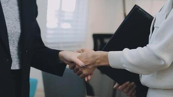 Business handshake for teamwork of business merger and acquisition,successful negotiate,hand shake,two businessman shake hand with partner to celebration partnership and business deal concept video