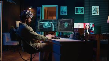 Developer using EEG headset device to upload his brain into computer, attaining immortality. Neuroscientist runs experiment, transfers consciousness into cyberspace, transhumanism concept, camera B video