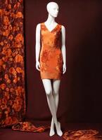 AI generated Fashionable evening orange summer dress on a mannequin. ai generative. ai generative photo