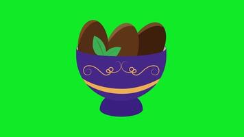 an illustration of a cup with chocolate eggs video