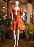 AI generated Fashionable evening orange summer dress on a mannequin. ai generative. ai generative photo