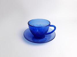 blue glass cup on white background photo