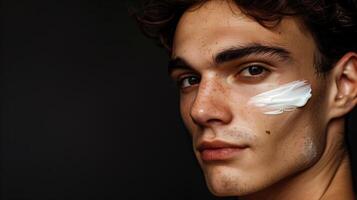AI generated A handsome young man with cream on his face, against a black background. Skin care products on his face. Generated by artificial intelligence. photo
