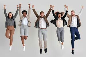 AI generated Group of multiracial people in suits jumping in the air on white background photo