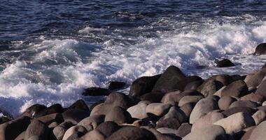 A slow motion of wave at the coast sunny day telephoto shot video