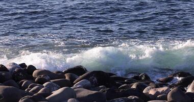 A slow motion of wave at the coast sunny day video