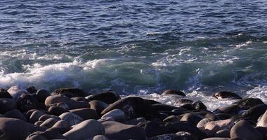 A slow motion of wave at the coast sunny day video