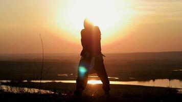 silhouette dancing against the background of the river video