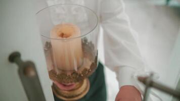 Close-up of hands holding a decorative candle lantern with a lit candle inside, symbolizing hope or celebration. video