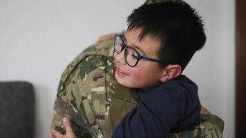 Military soldier embracing his son before leaving for the war video